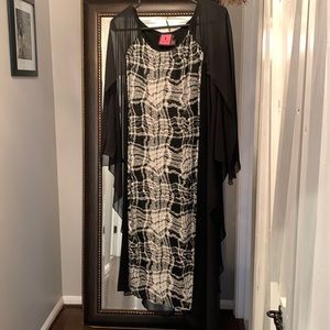Caped, black and white, plaid, boutique dress by Simon Chang.